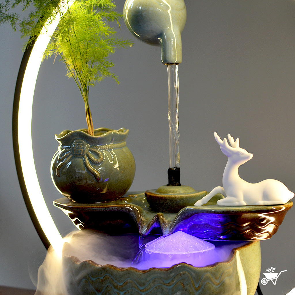 A Drop of Doe Water Fountain LED Decor Zen Garden – tabletop fountain scene with deer and mist