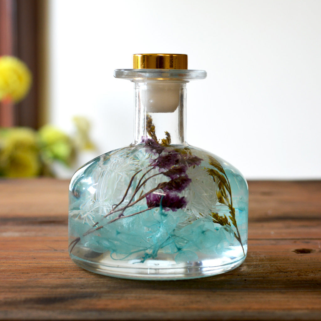 Close-up of Bluebell Blossom Preserved Flower Tabletop by myBageecha – blue preserved blooms in square bottle décor.