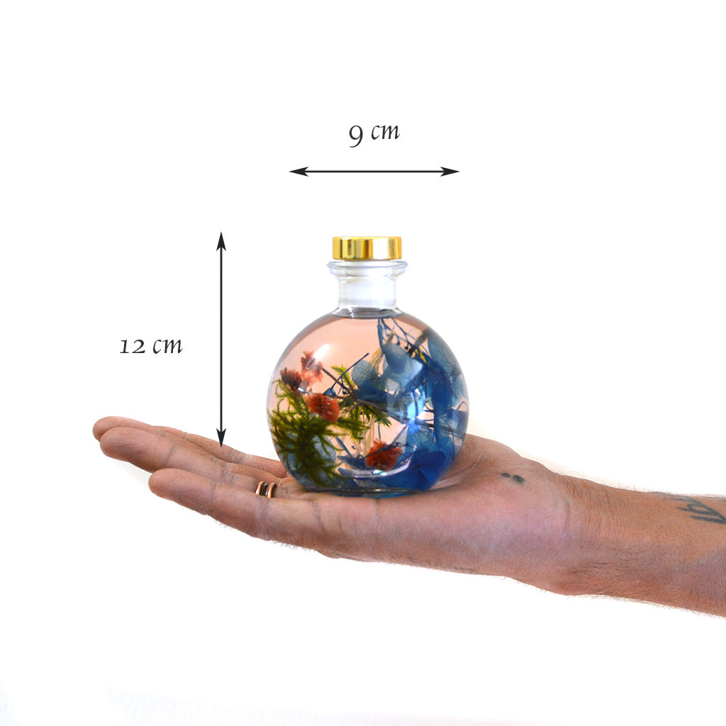 Coastal Zephyr Preserved Flower Tabletop shown in hand – compact coastal-inspired décor.