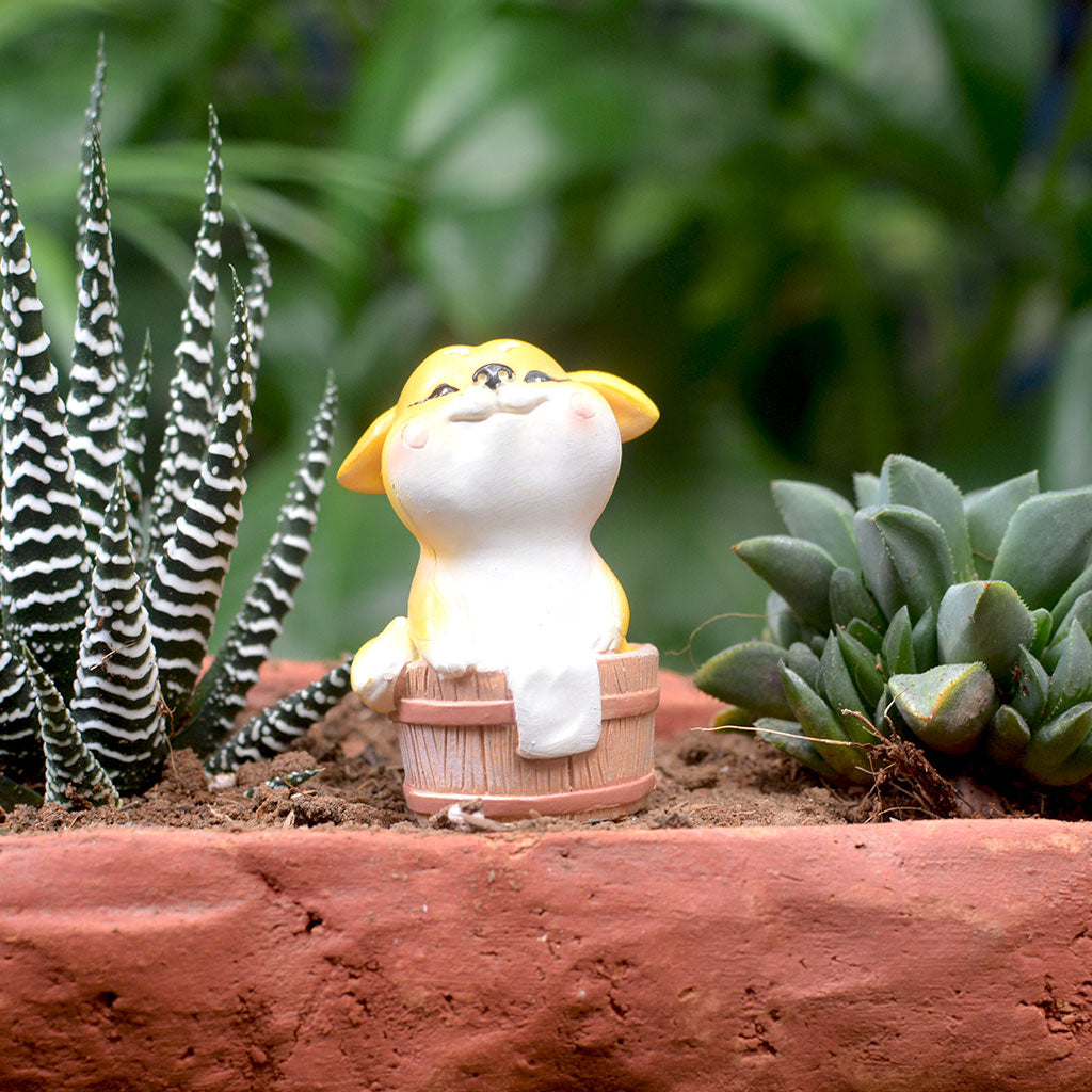 Resin dog in tub figurine