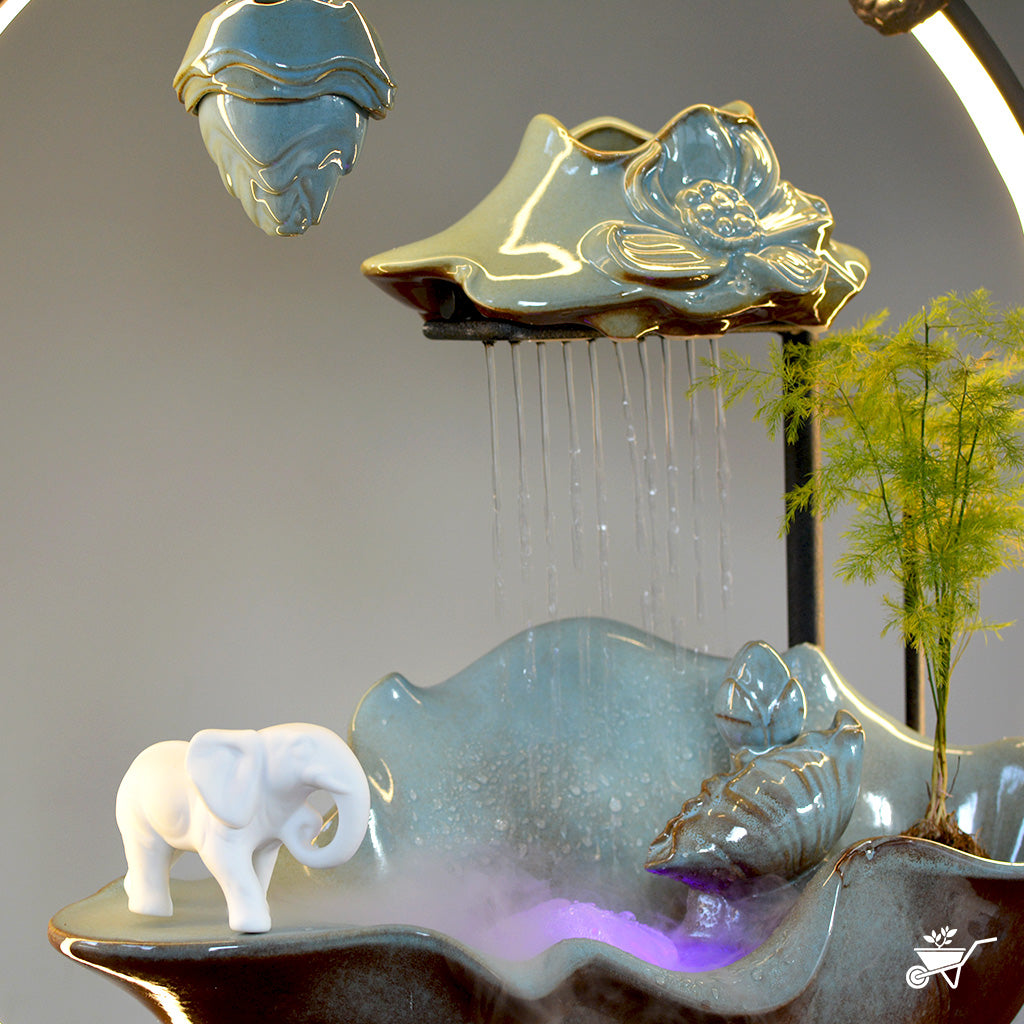 Elephant’s Oasis Water Fountain LED Decor Zen Garden – close-up of elephant figurines near water flow