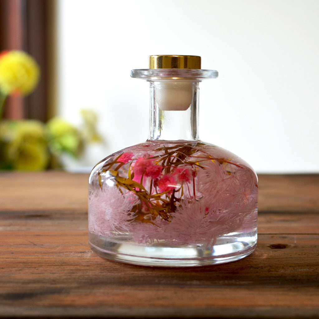 Close-up of Evening Primrose Preserved Flower Tabletop by myBageecha – soft pink preserved blooms in round bottle.