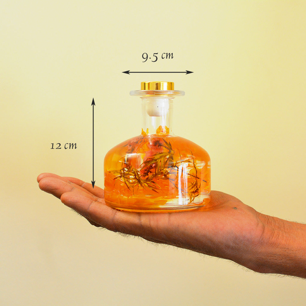 Golden Poppy Preserved Flower Tabletop shown in hand to highlight compact uplifting size.