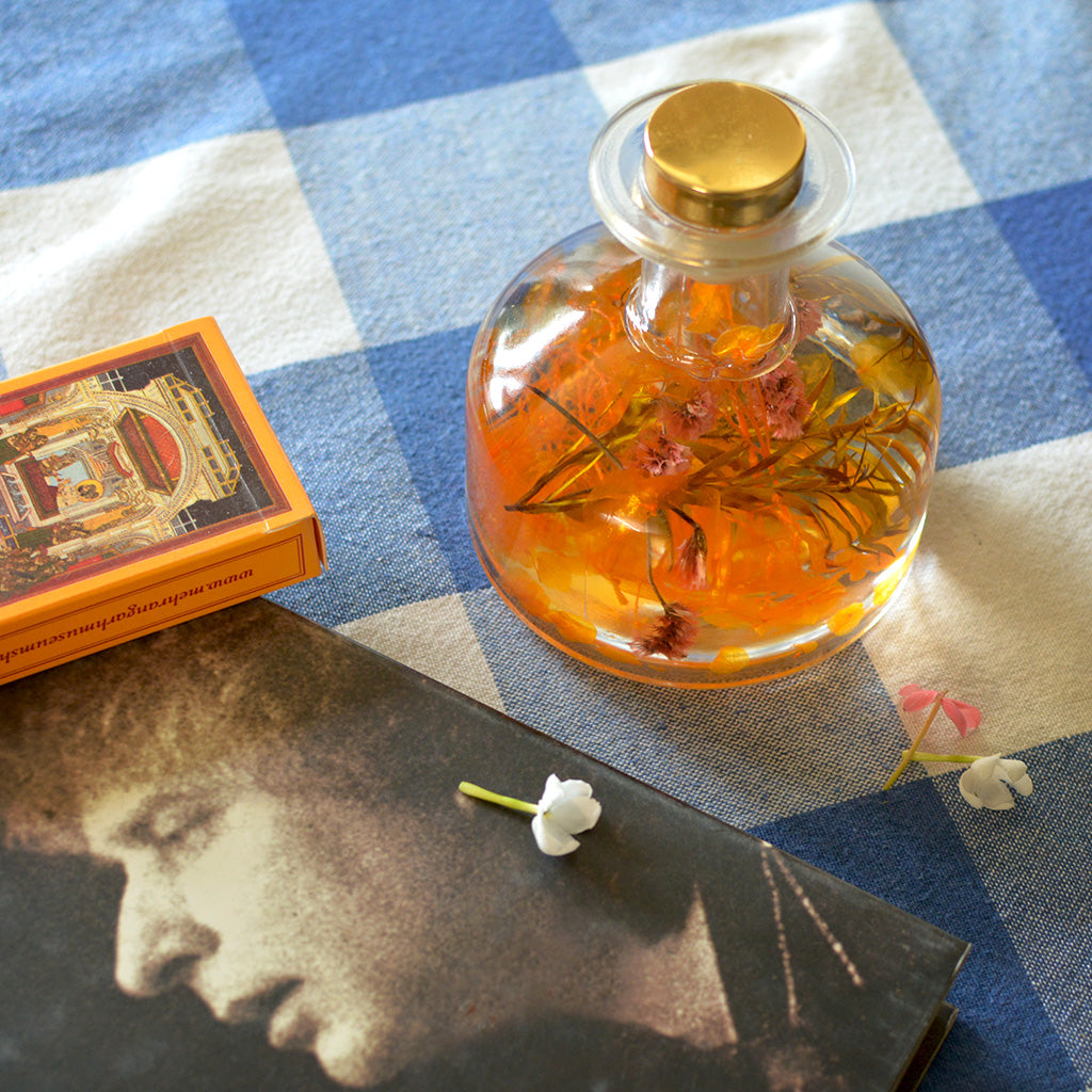 Golden Poppy Preserved Flower Tabletop placed on table – cheerful, joyful décor accent.