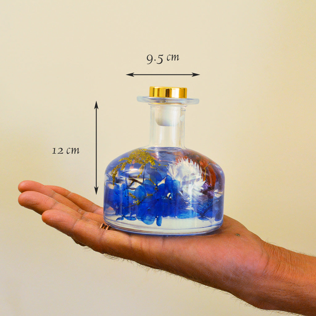 Gurgling Creek Preserved Flower Tabletop shown in hand to show natural compact scale.