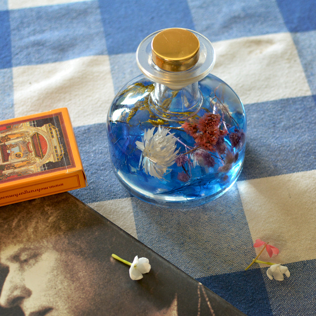 Gurgling Creek Preserved Flower Tabletop placed on table – forest & mountain-inspired home décor accent.