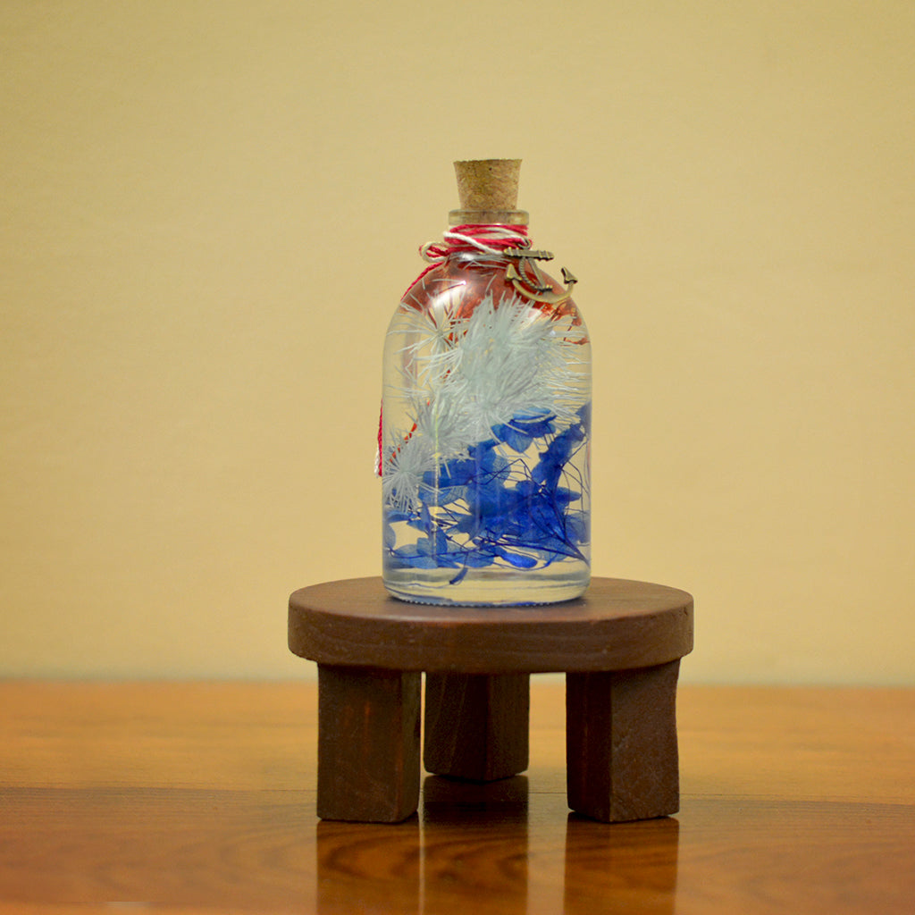 Indigo Florescence Preserved Flower Tabletop on circular stand – striking centerpiece décor.