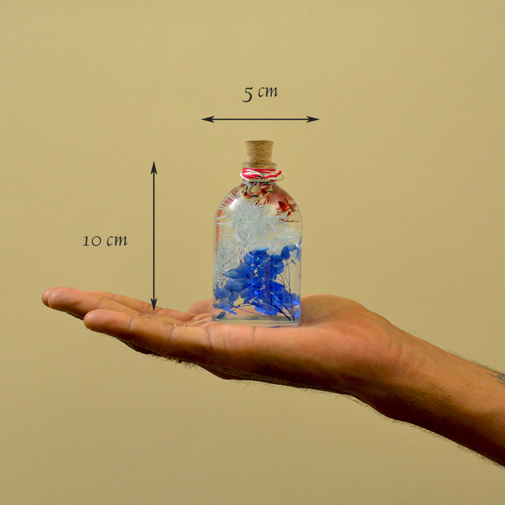 Indigo Florescence Preserved Flower Tabletop shown in hand – refined bold décor accent.