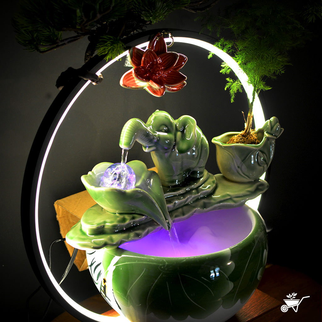 Jade Green Baby Elephant Water Fountain LED Decor Zen Garden – side angle showing LED glow and water path