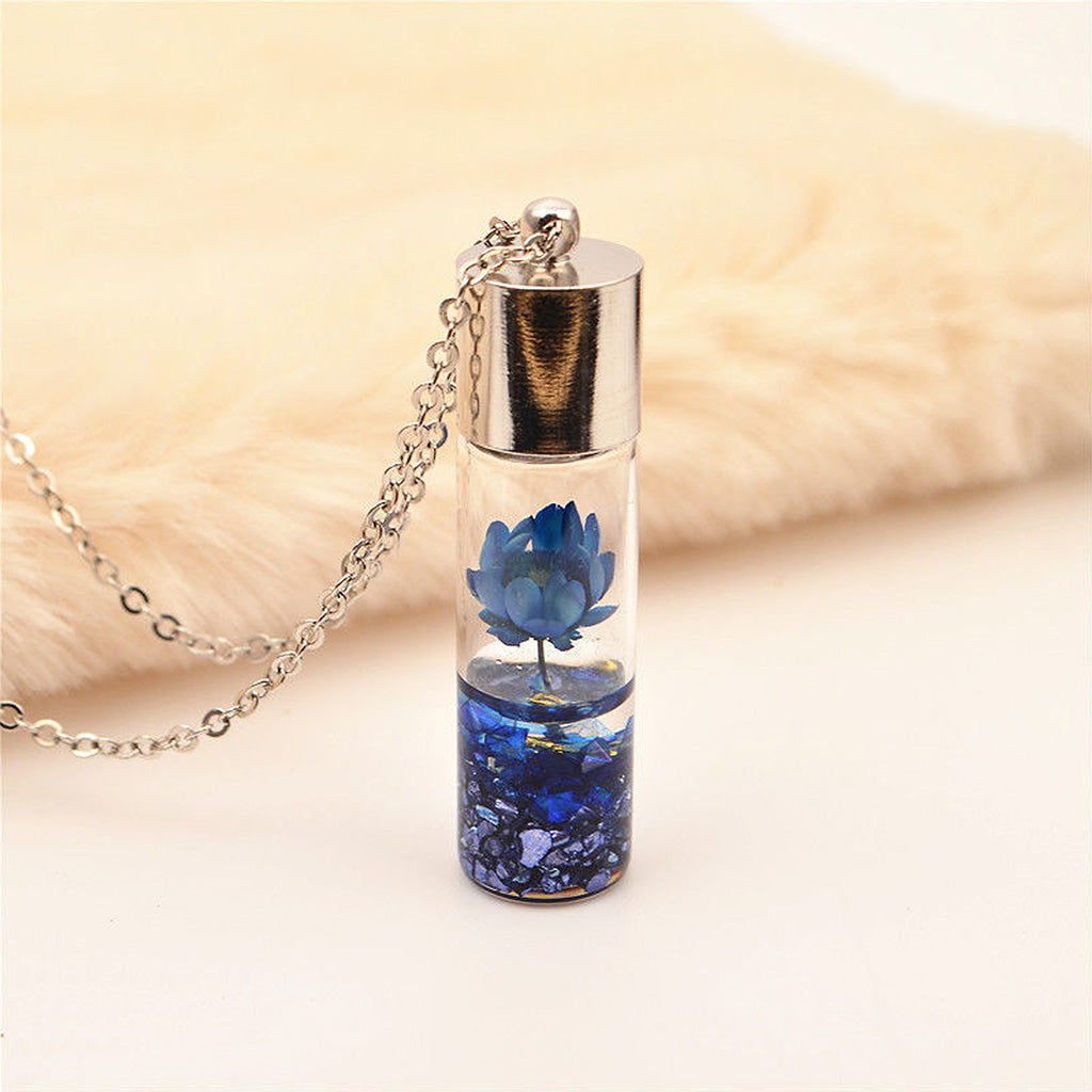 Blue Lyrical Lotus real dried flower resin necklace with delicate handcrafted detailing