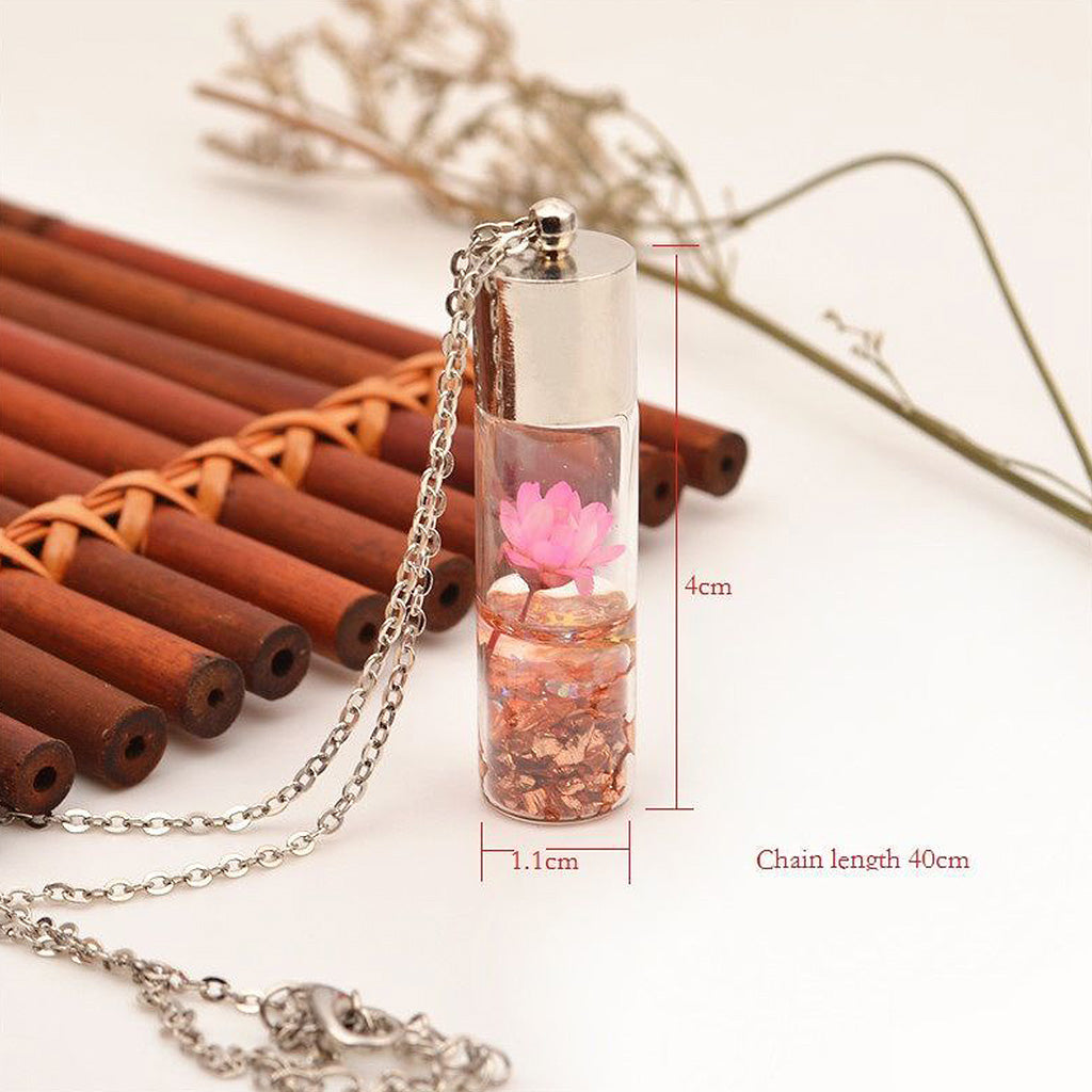 Elegant handcrafted botanical necklace featuring preserved lotus-style flower in glossy resin