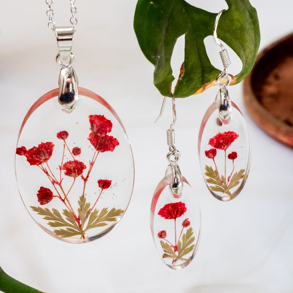 Paint It Red necklace and earring set featuring real preserved blooms in clear resin
