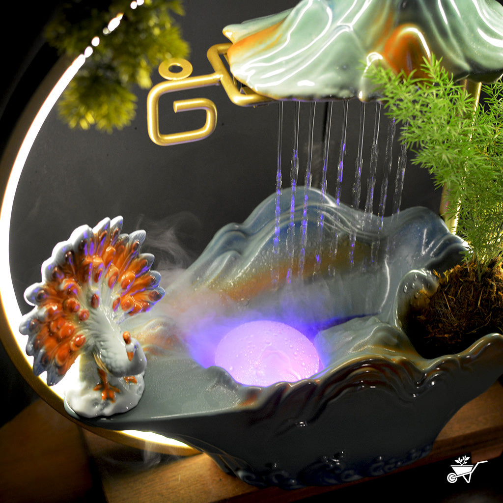 Peacock’s Rain Dance Water Fountain LED Decor Zen Garden – angled shot showing LED reflections