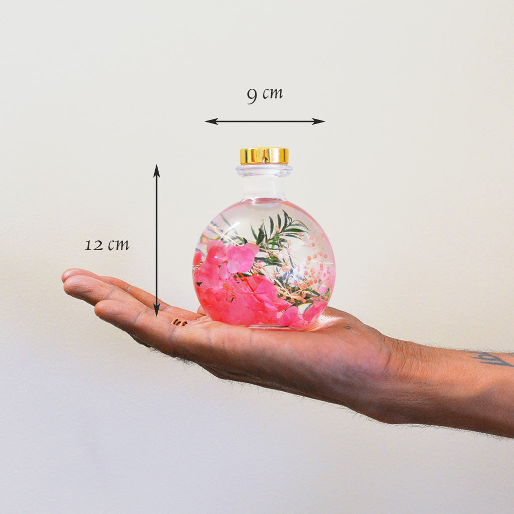Rosy Twilight Preserved Flower Tabletop shown in hand for scale – compact romantic décor.