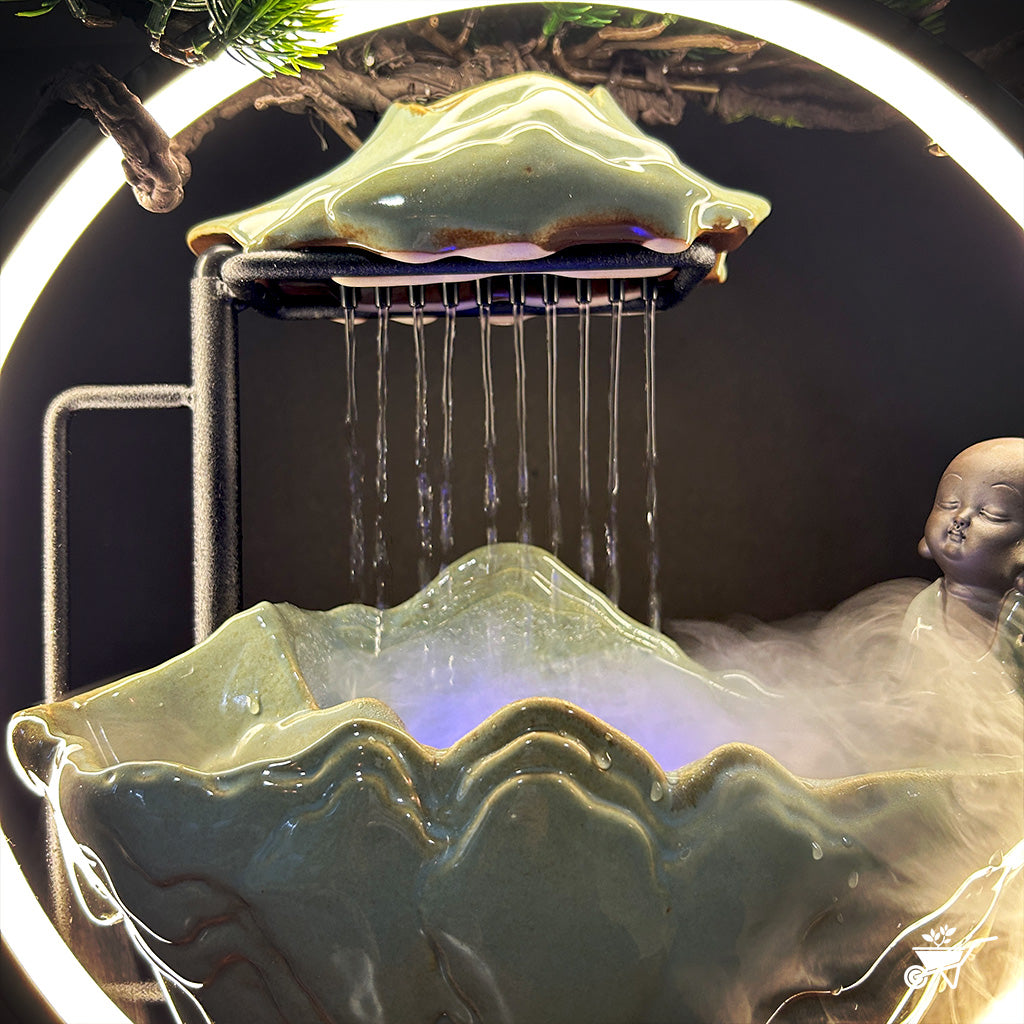 Sitting Monk Water Fountain LED Decor Zen Garden – angled shot showing LED and water flow
