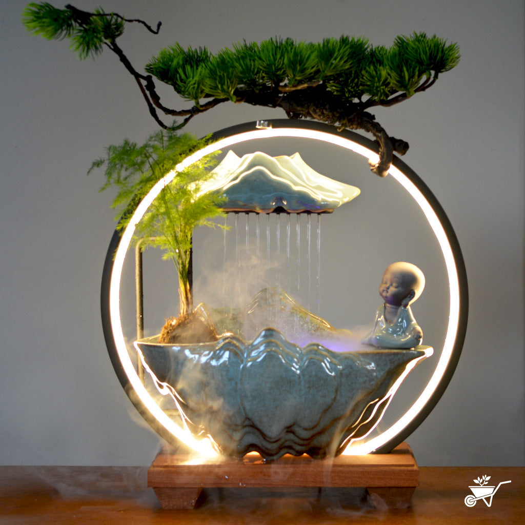 Sitting Monk Water Fountain LED Decor Zen Garden – meditating monk beside LED water stream – LED tabletop Zen fountain decor for calming ambience by myBageecha
