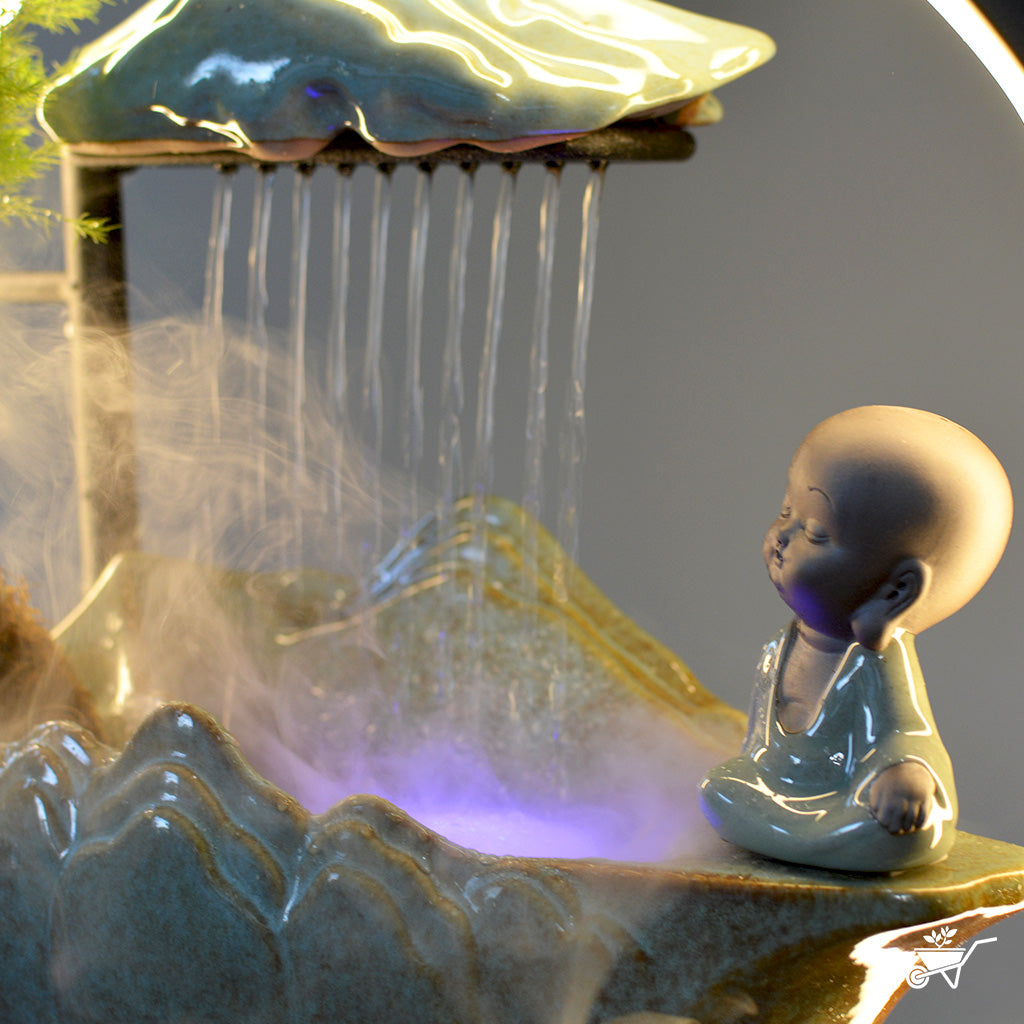 Sitting Monk Water Fountain LED Decor Zen Garden – close-up of monk figurine near LED fountain