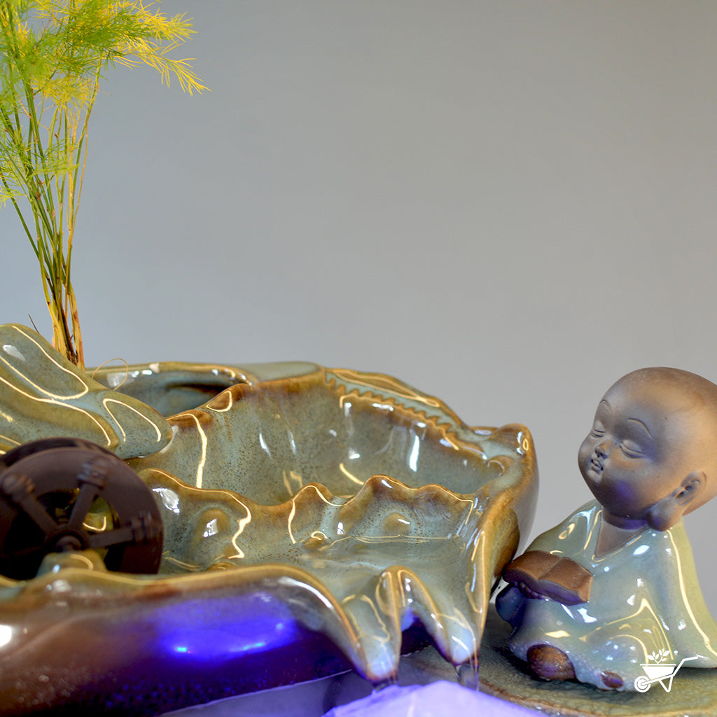 Thoughtful Monk Water Fountain LED Decor Zen Garden – close-up of monk figure and water stream