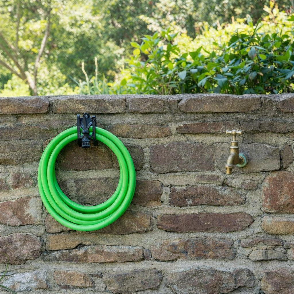 Decorative Wall Mounted Hose Pipe Holder on garden wall