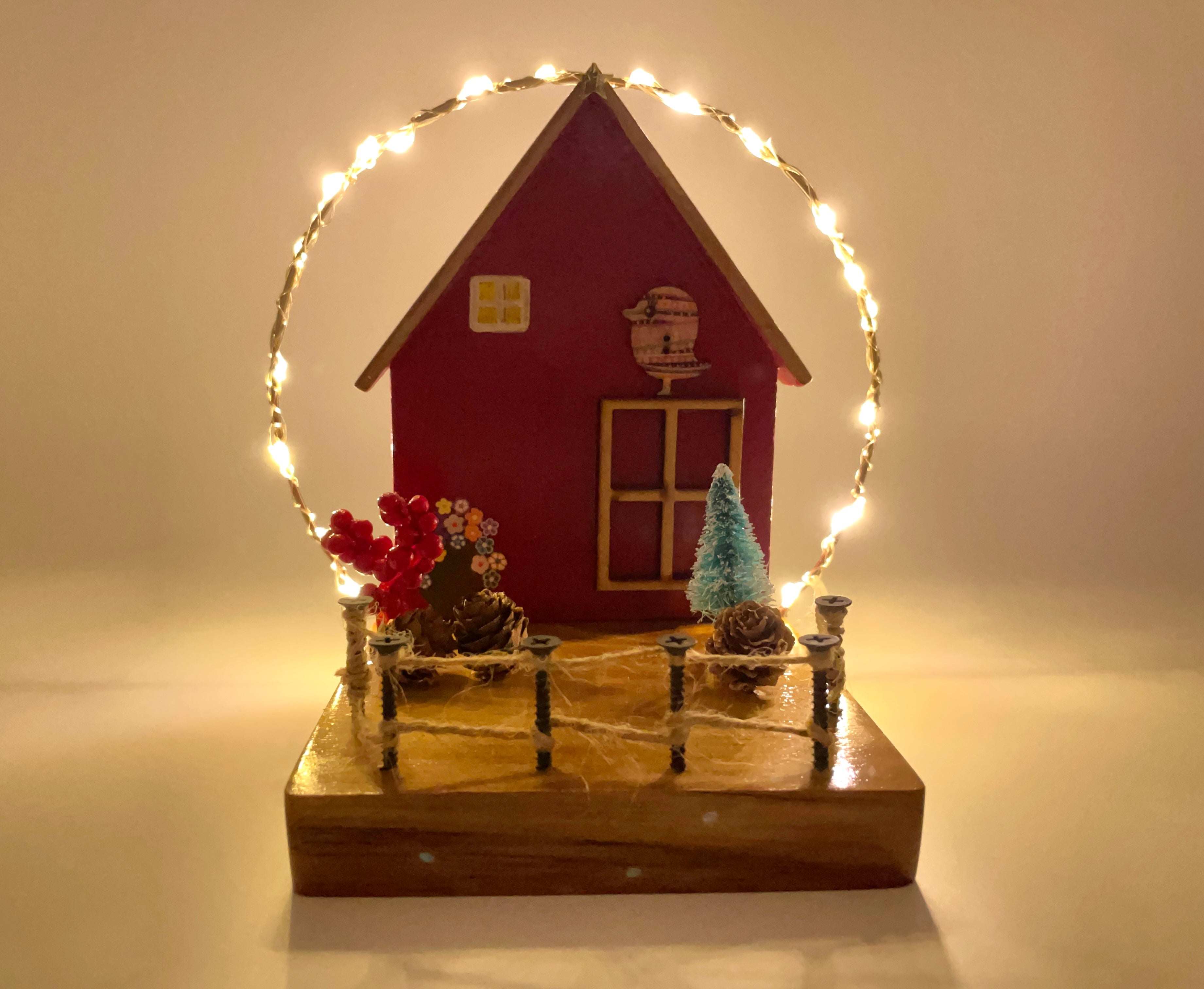 Red Cottage With String Lights Decor