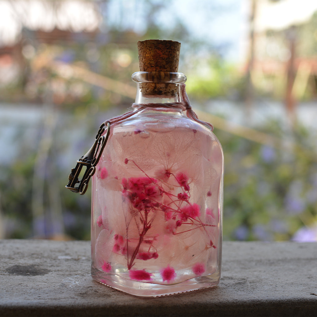 Punky Pinks Preserved Flower Tabletop placed on table – cheerful floral accent.