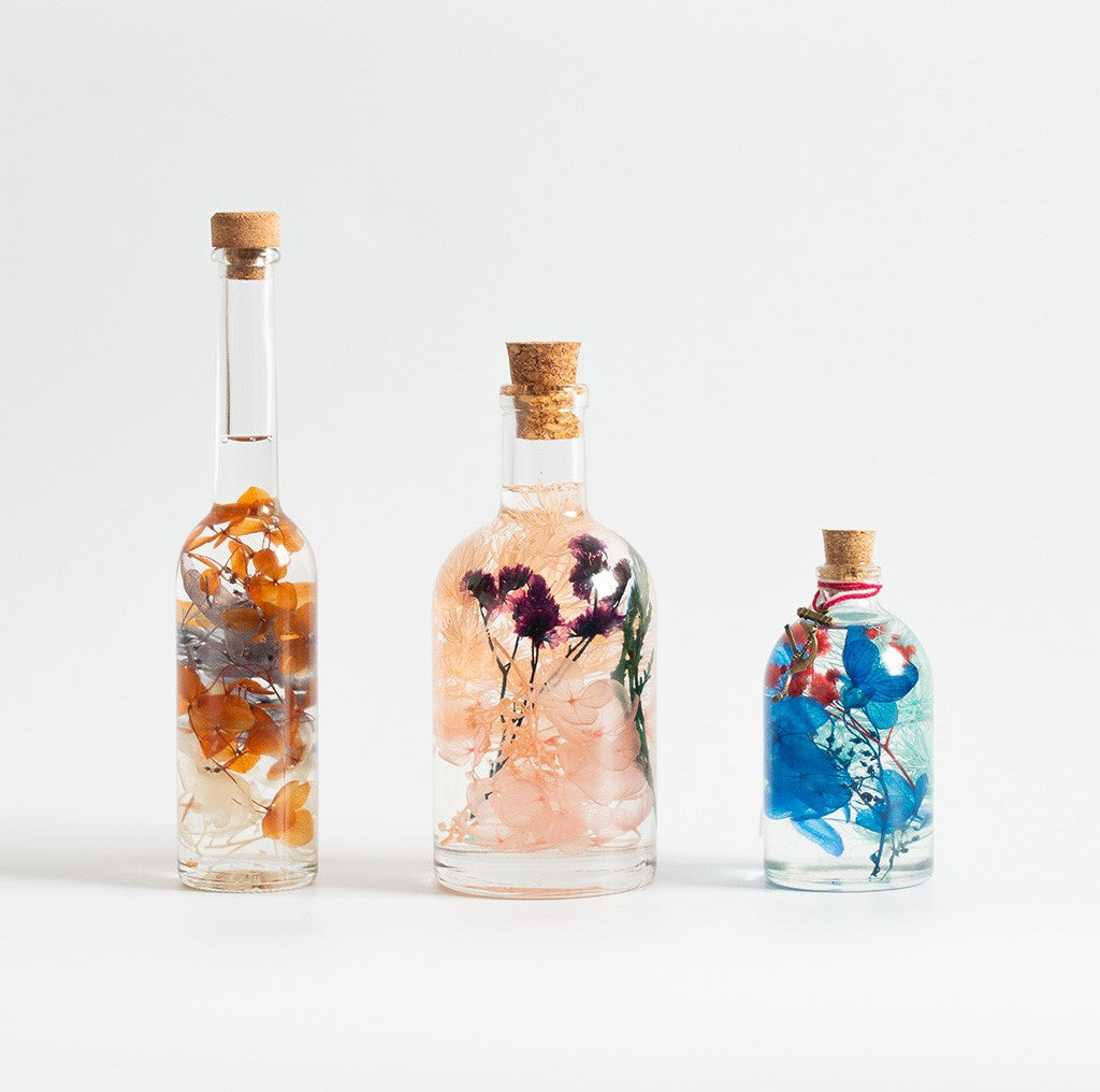 Set of Fused Trinary Tabletop Decor by myBageecha – includes Honey Glimpses, Peachy Peep, Indigo Florescence preserved décor bottles.