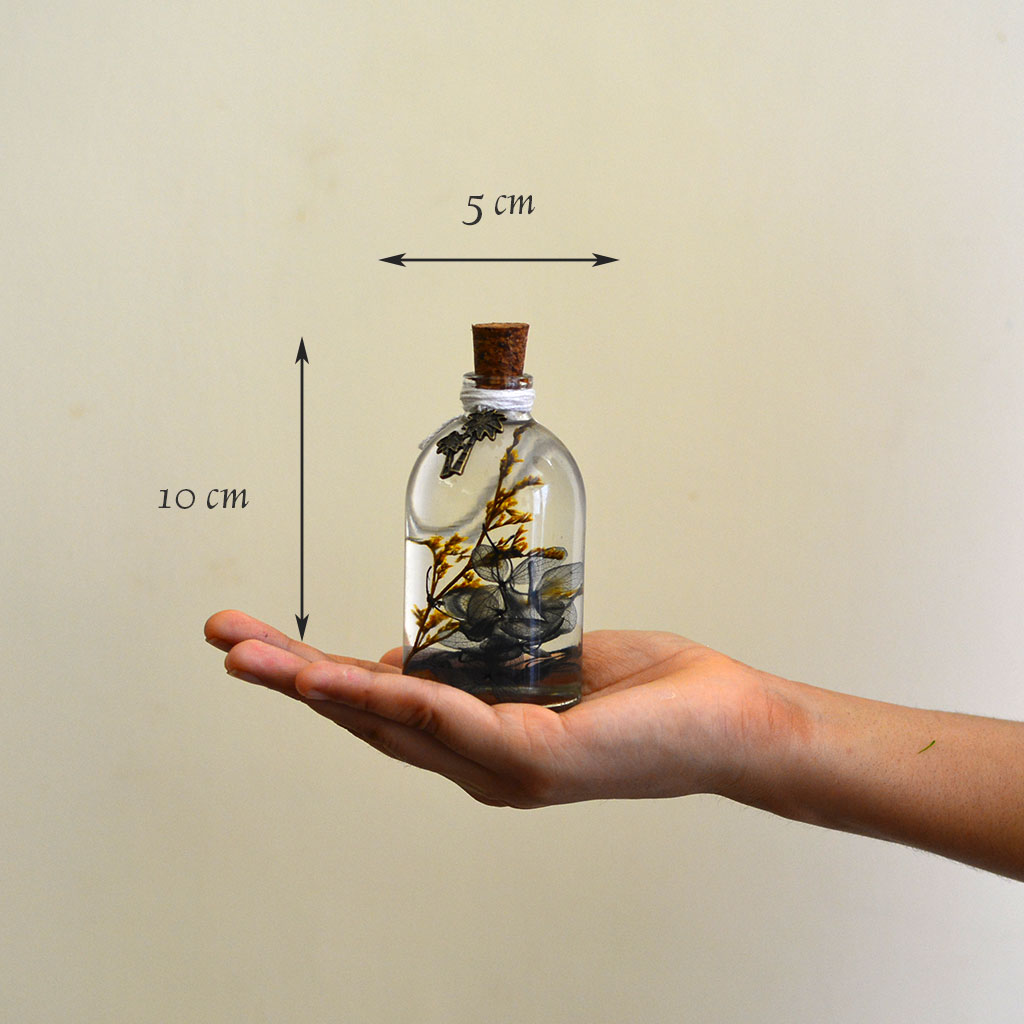 A Golden Lining Preserved Flower Tabletop shown in hand – joyful preserved décor piece.