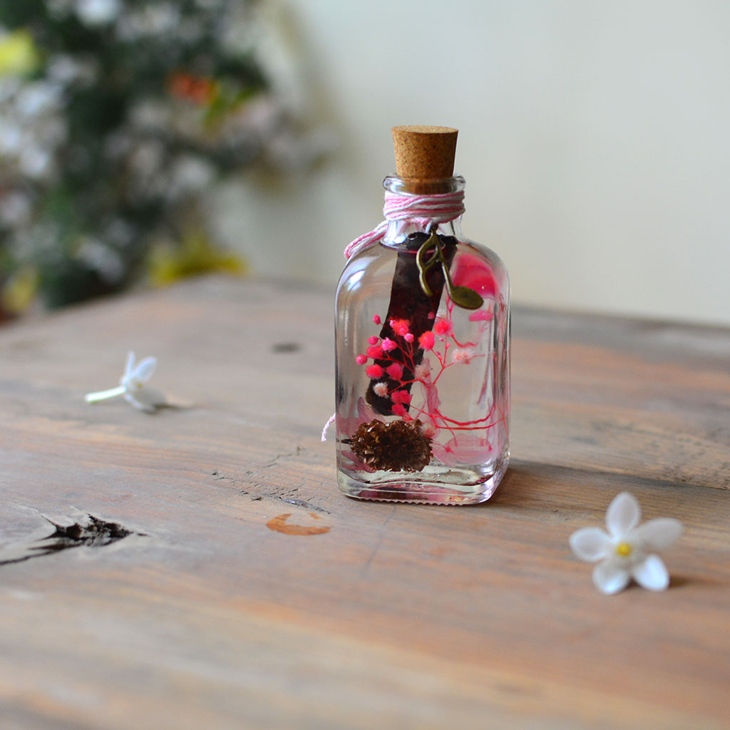 Close-up of Adverse Allure Preserved Flower Tabletop by myBageecha – moody contrast preserved blooms.