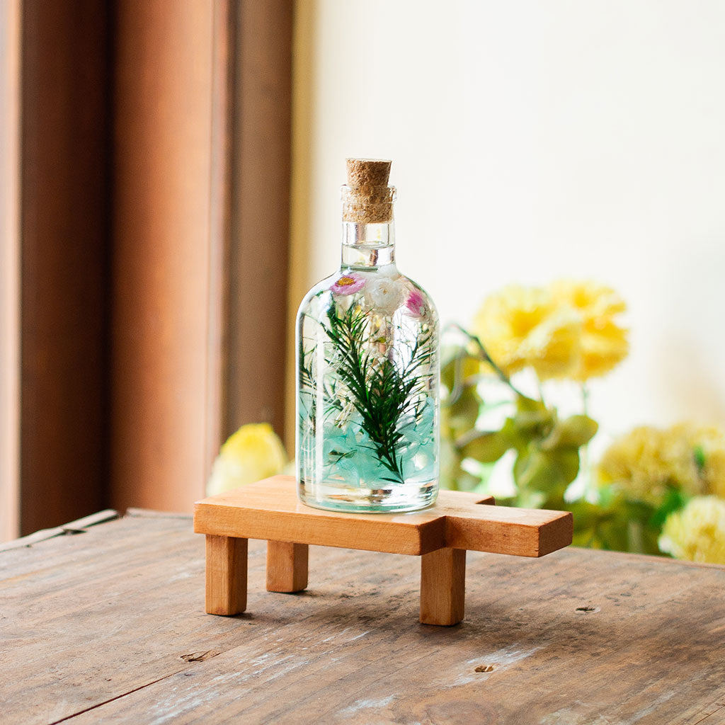 Aqua Spring Preserved Flower Tabletop on rectangular stand – gentle aqua-toned preserved décor.