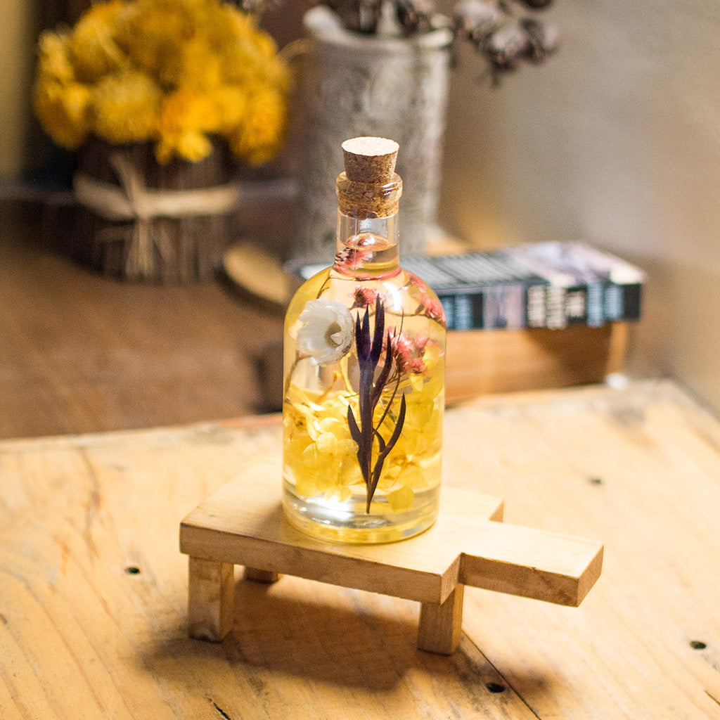 Baroque Carafe Preserved Flower Tabletop on rectangular stand – refined décor presentation.