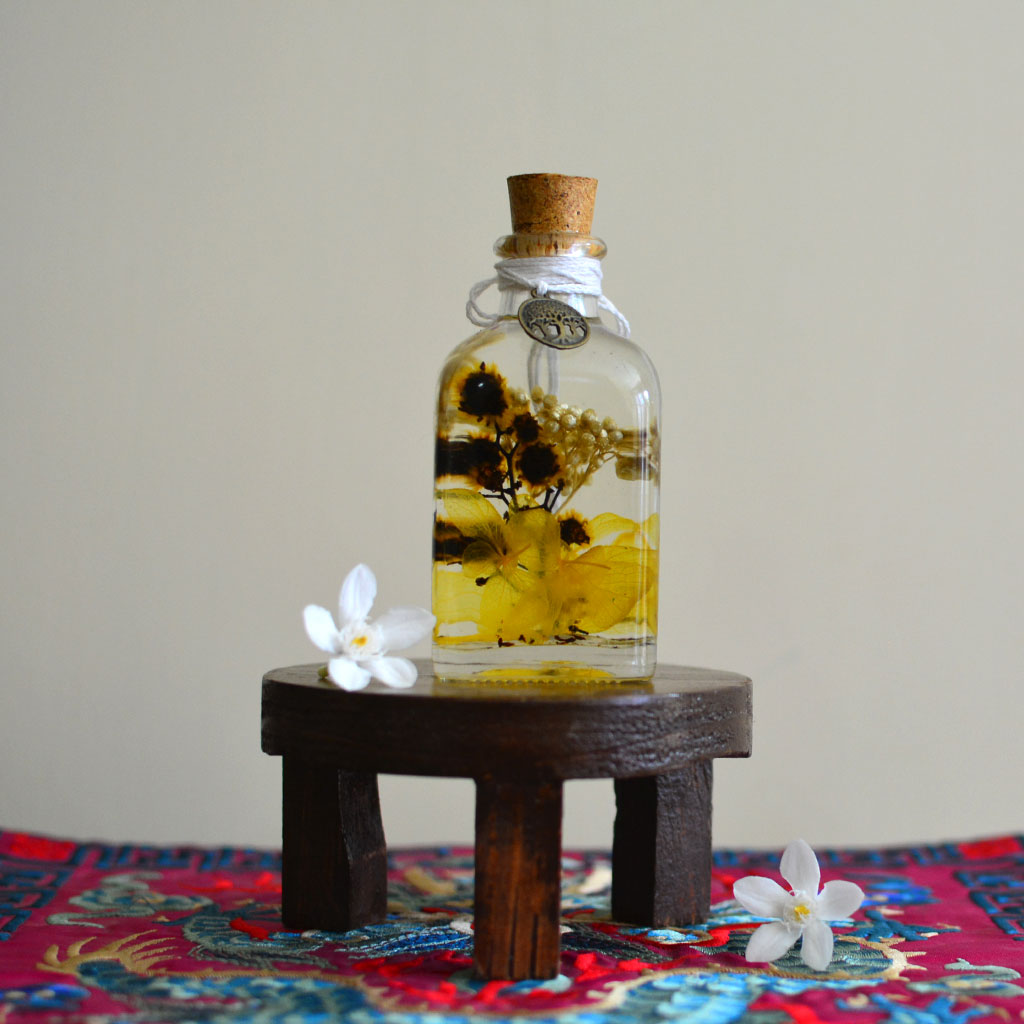 Blazing with Blooms Flower Tabletop on circular stand – statement décor piece.