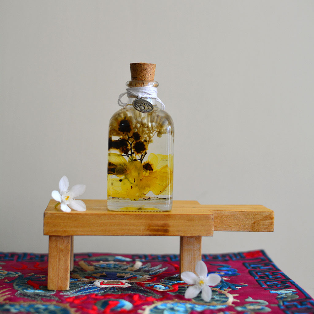 Blazing with Blooms Flower Tabletop on rectangular stand – dramatic preserved display.