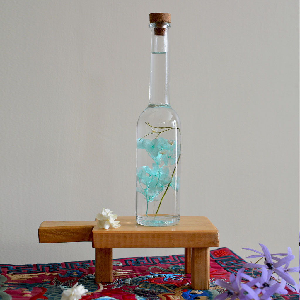 Blossoms of the Sky Preserved Flower Tabletop on rectangular stand – serene décor accent.