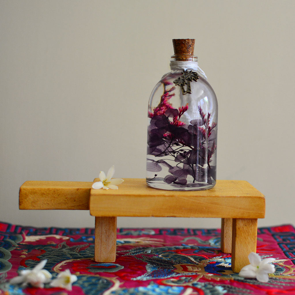 Blushing Mauve Preserved Flower Tabletop on rectangular stand – romantic preserved display.