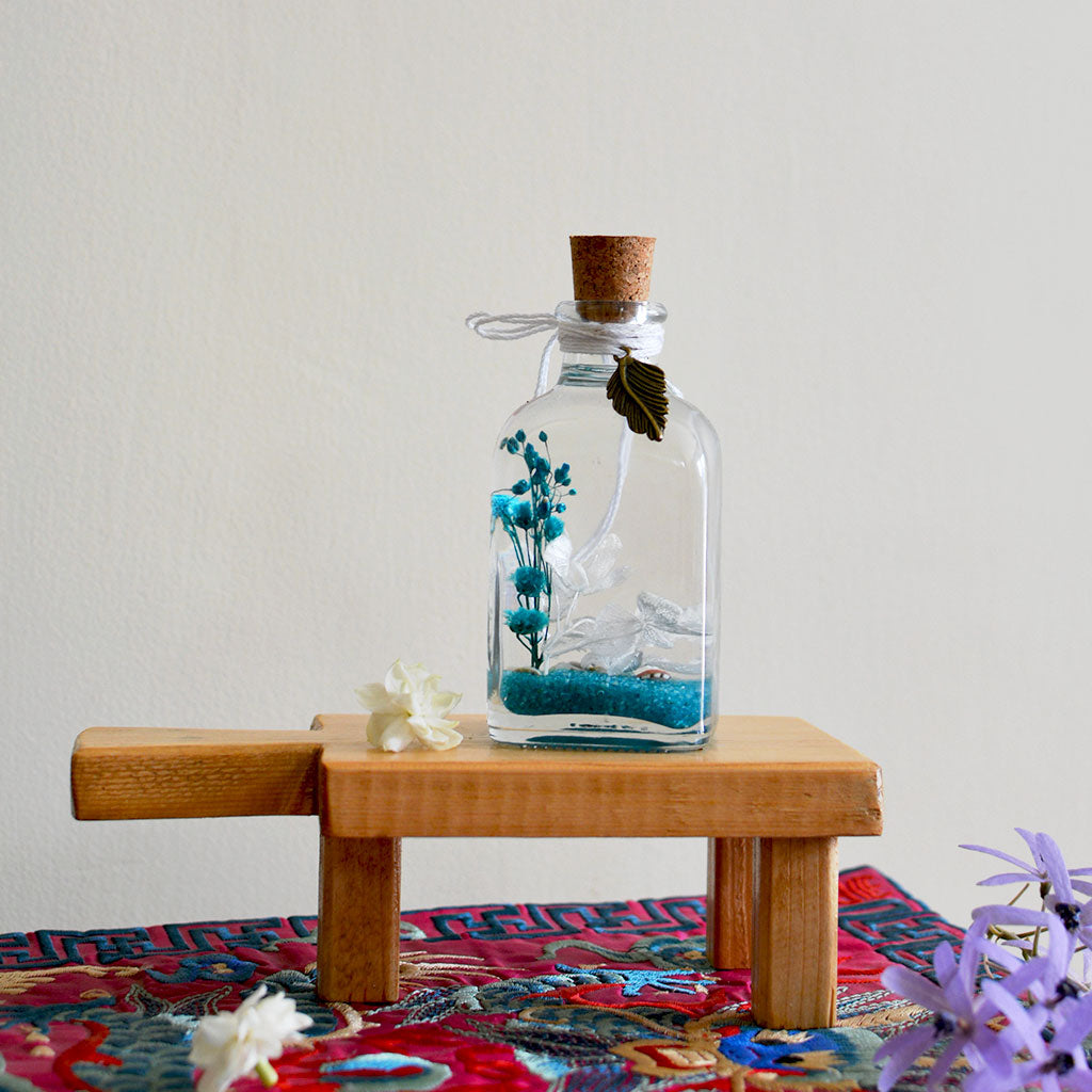 By The Bay Preserved Flower Tabletop on rectangular stand – cool ocean-inspired décor display.