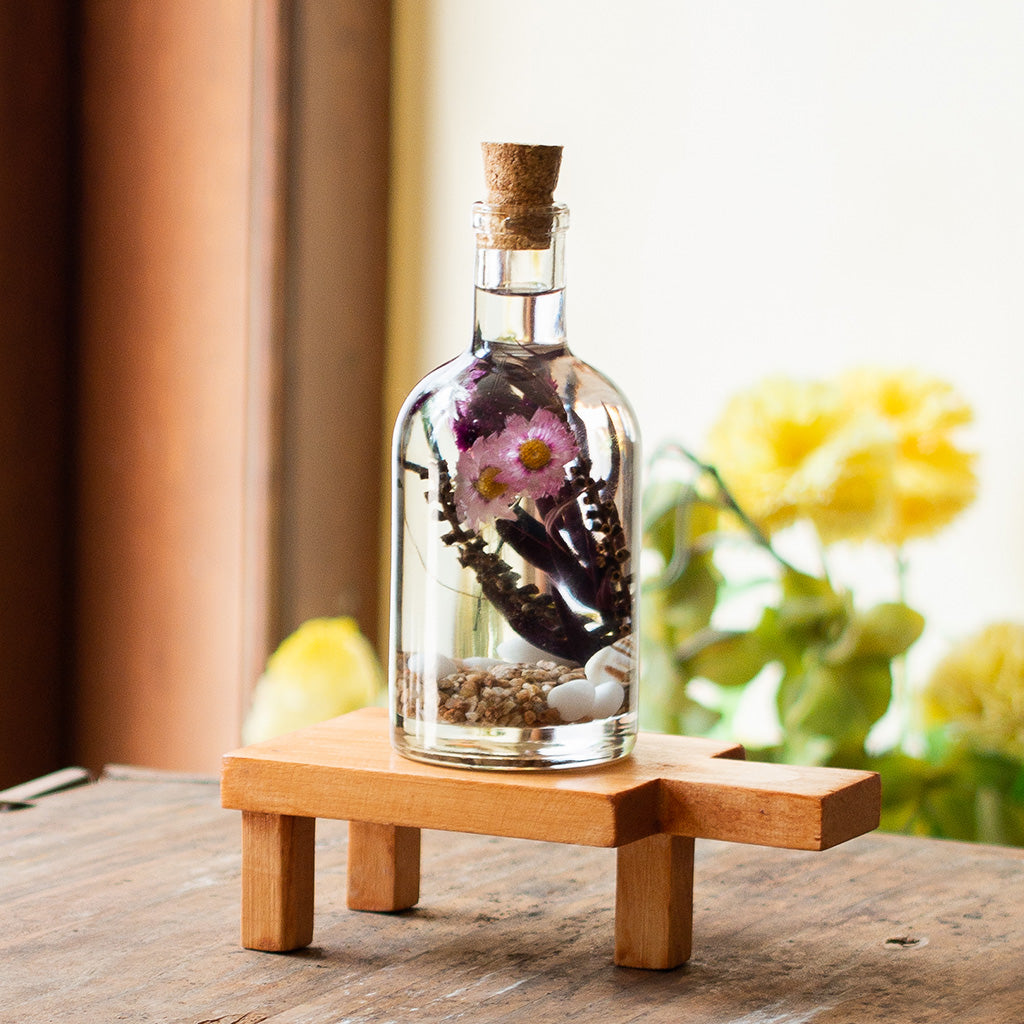 Curtained Wilderness Preserved Flower Tabletop on rectangular stand – forest-inspired preserved arrangement.