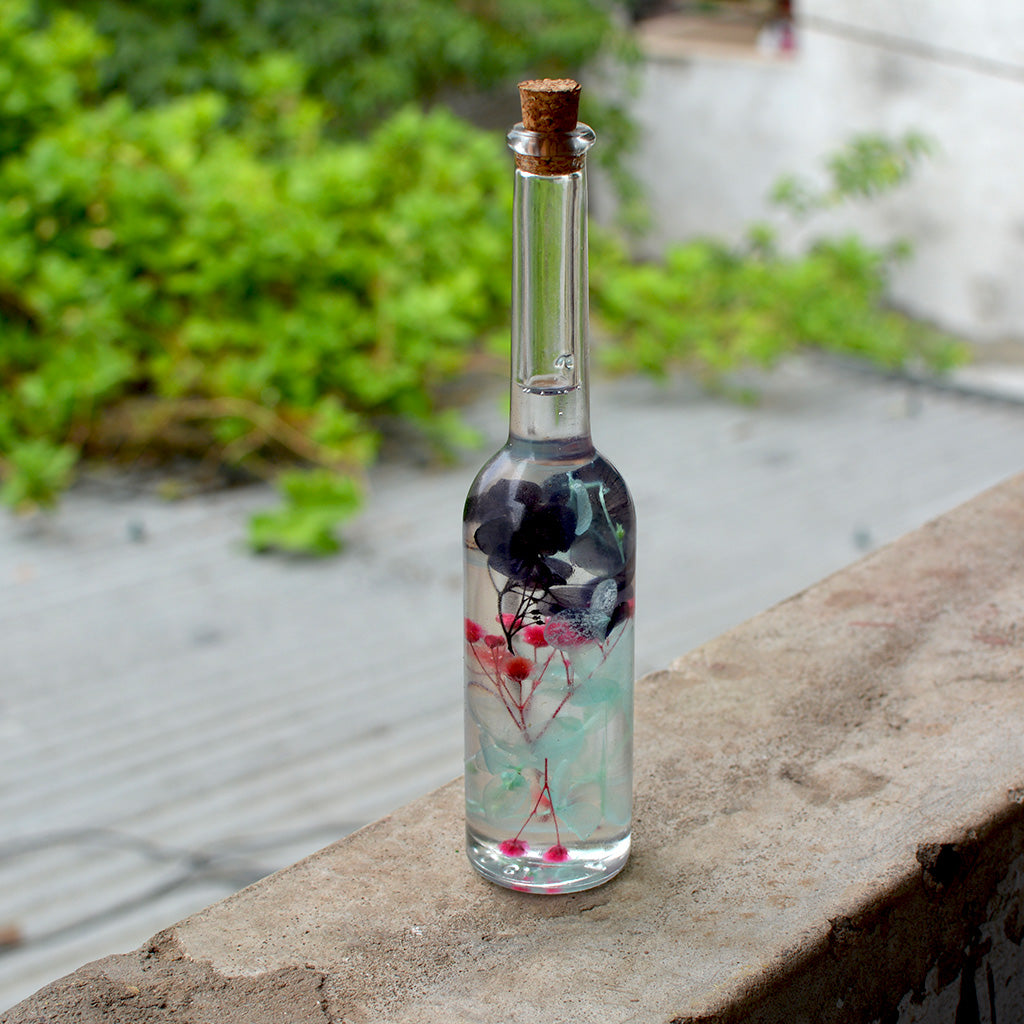 Close-up of Diablerie Stir Preserved Flower Tabletop by myBageecha – bold, dramatic preserved blooms.