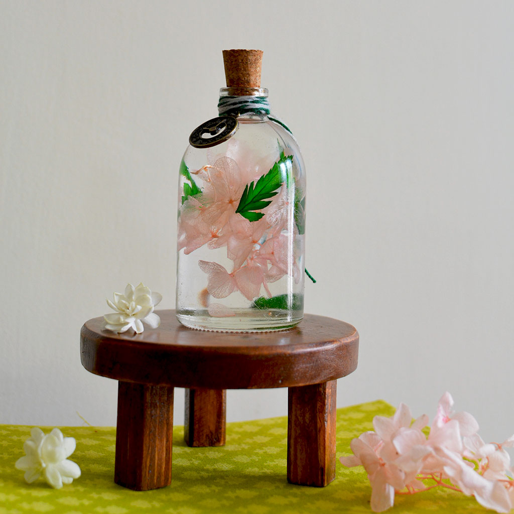 Eternal Flora Preserved Flower Tabletop on circular stand – charming tabletop décor.