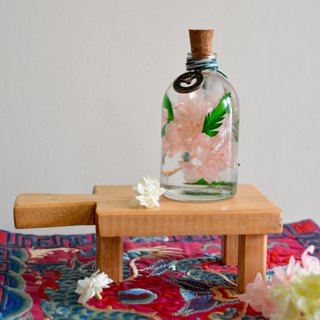 Eternal Flora Preserved Flower Tabletop on rectangular stand – classic preserved arrangement.