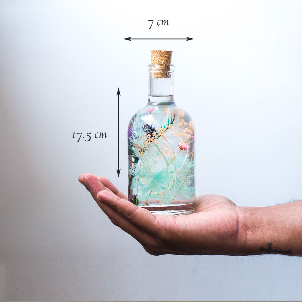 Frolicking Blues Preserved Flower Tabletop shown in hand – refreshing blue décor accent.