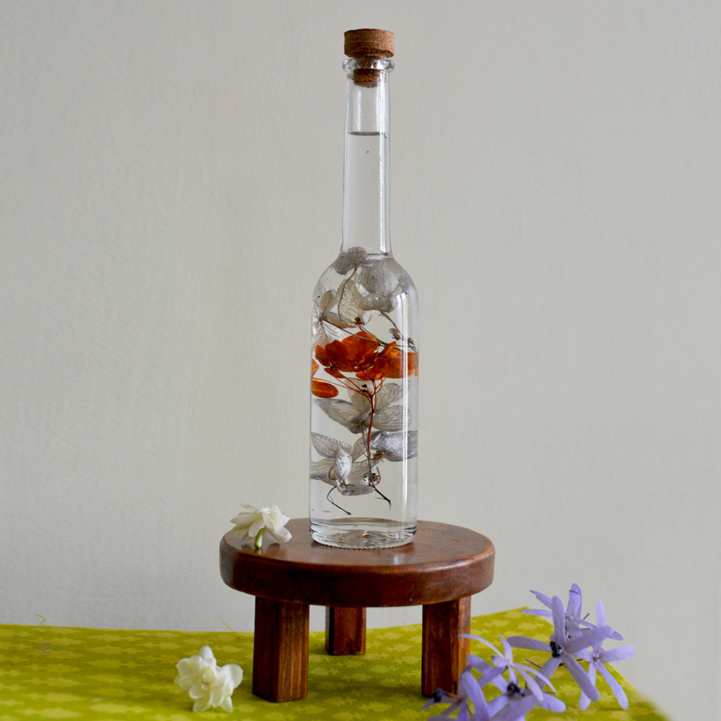 Honey Glimpses Preserved Flower Tabletop on circular stand – uplifting centerpiece.