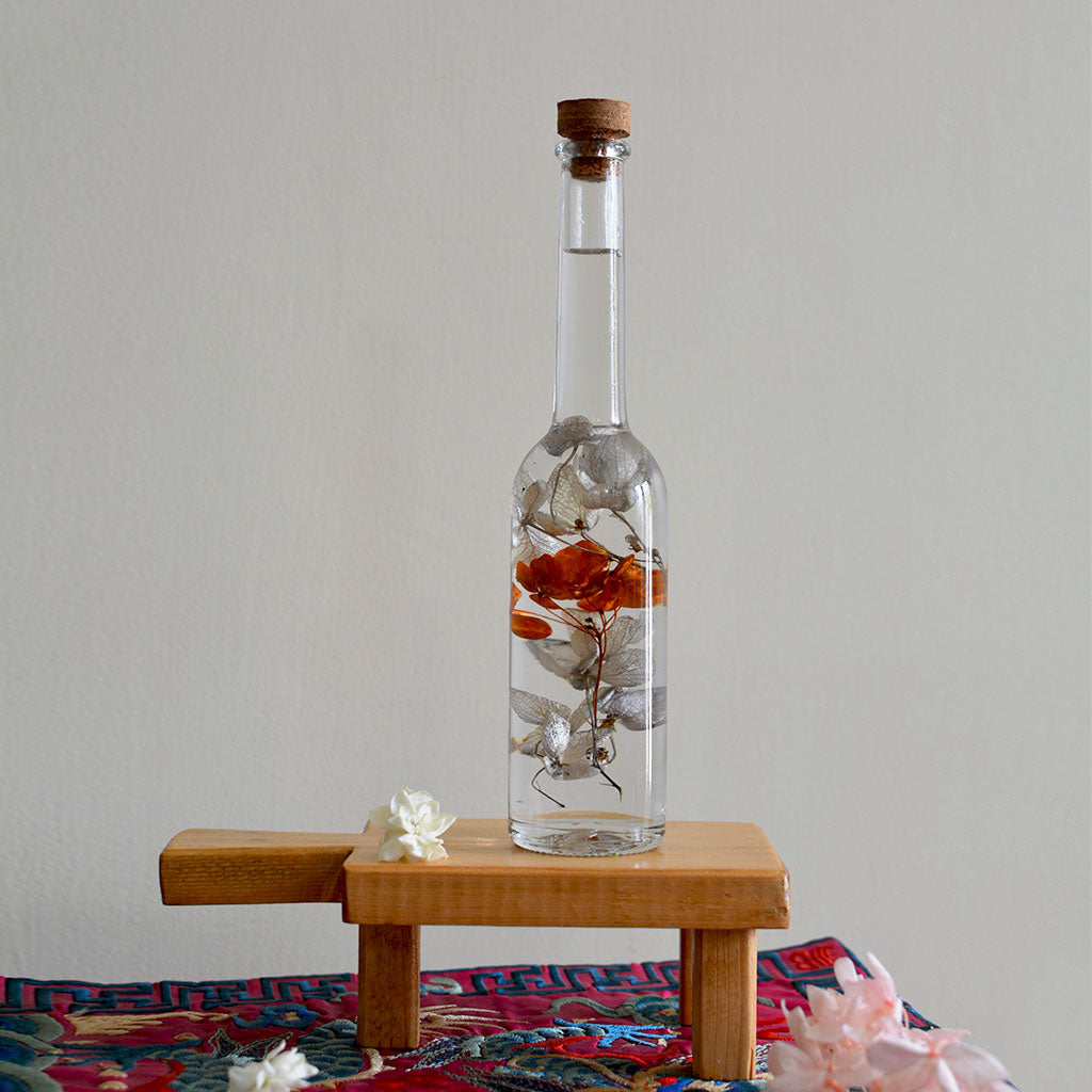 Honey Glimpses Preserved Flower Tabletop on rectangular stand – warm cheerful décor display.