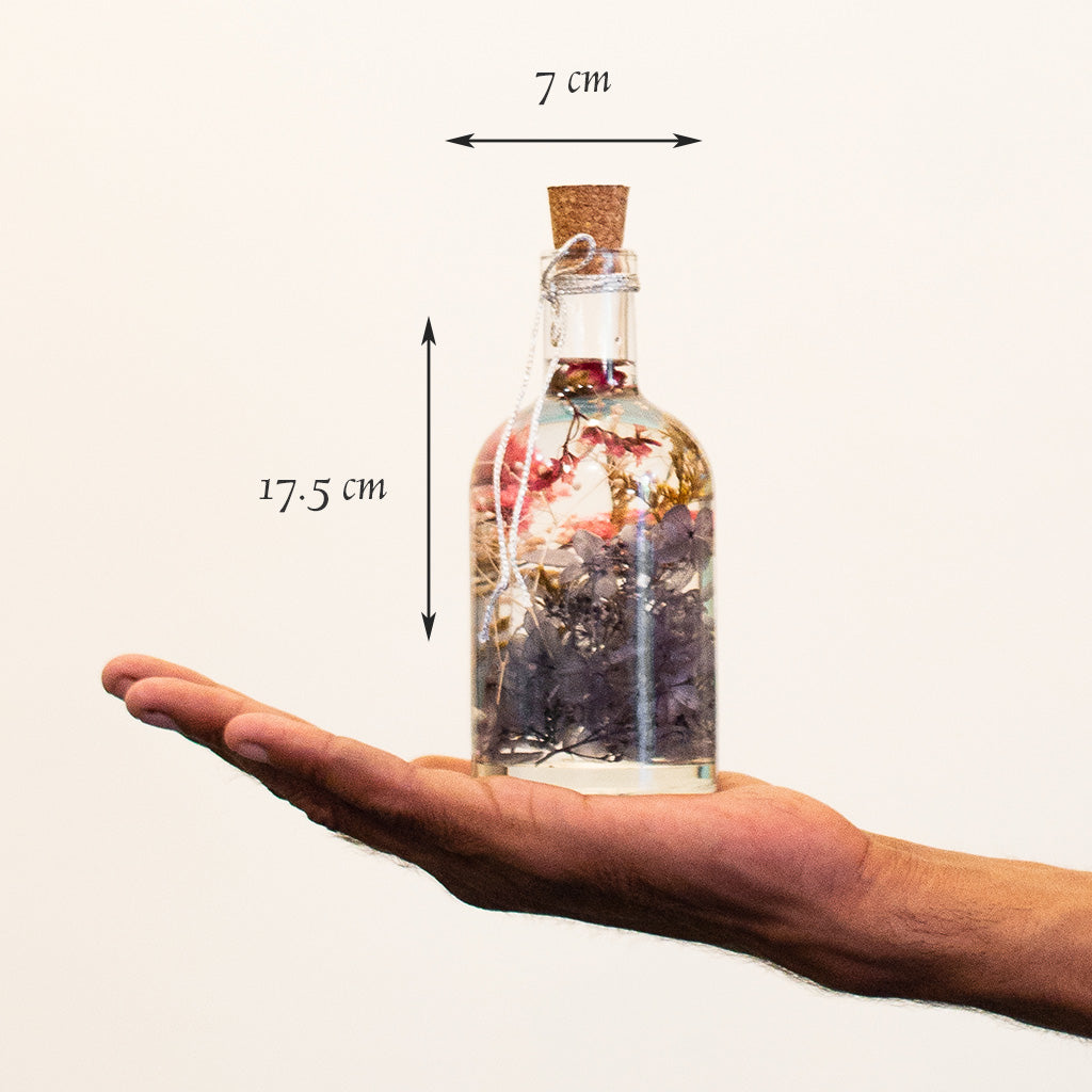 Hushed Caprice Preserved Flower Tabletop shown in hand – airy and subtle décor piece.