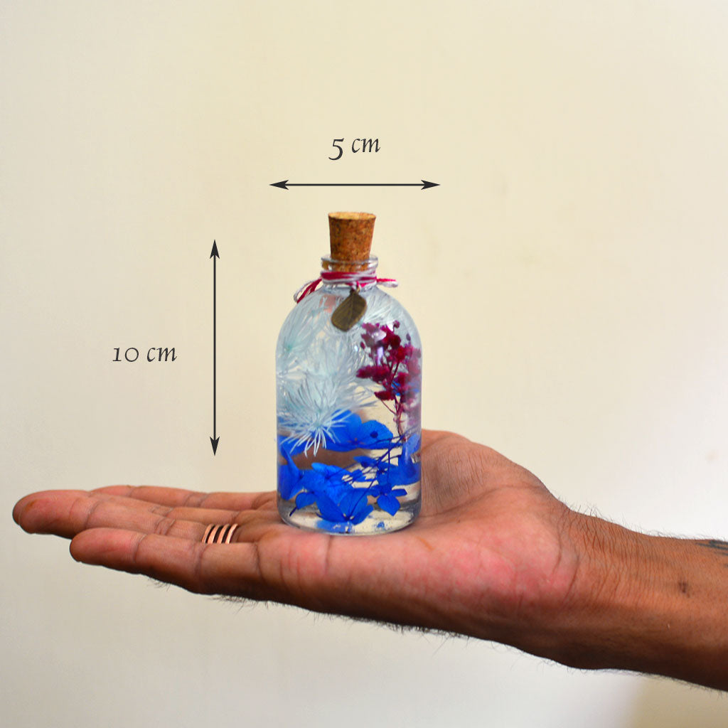 Indigo Florescence preserved bottle shown individually – deep indigo preserved flower décor.