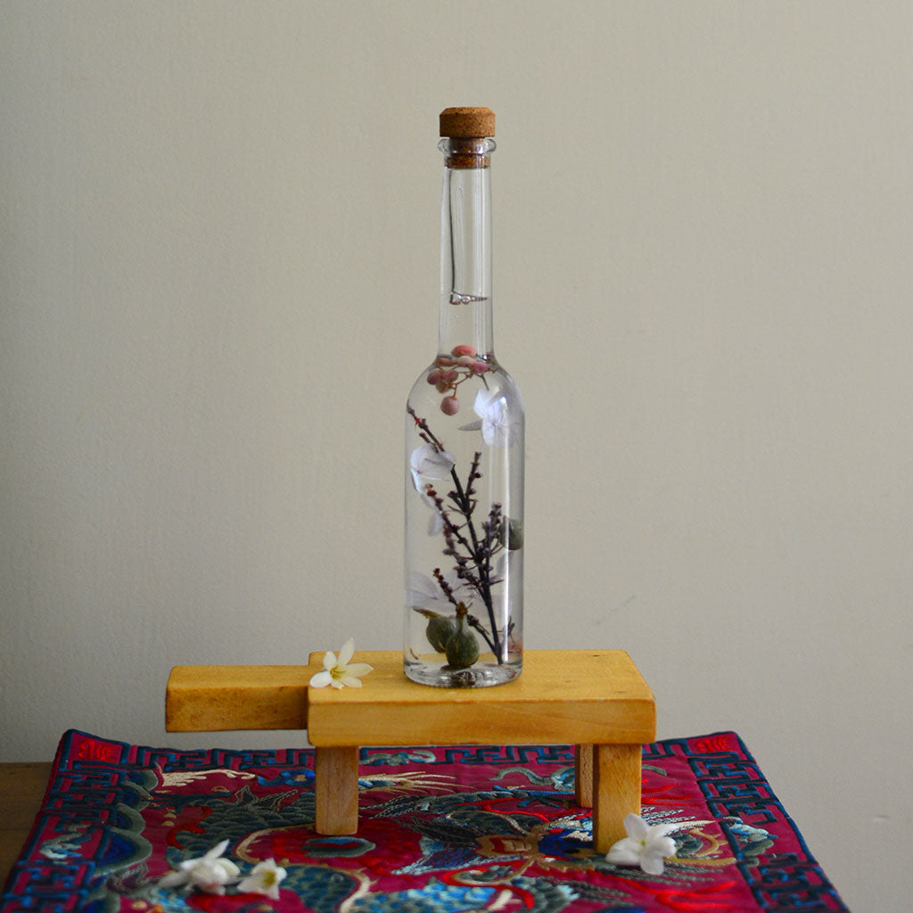 Magical Hinterlands Preserved Flower Tabletop on rectangular stand – rustic preserved floral display.