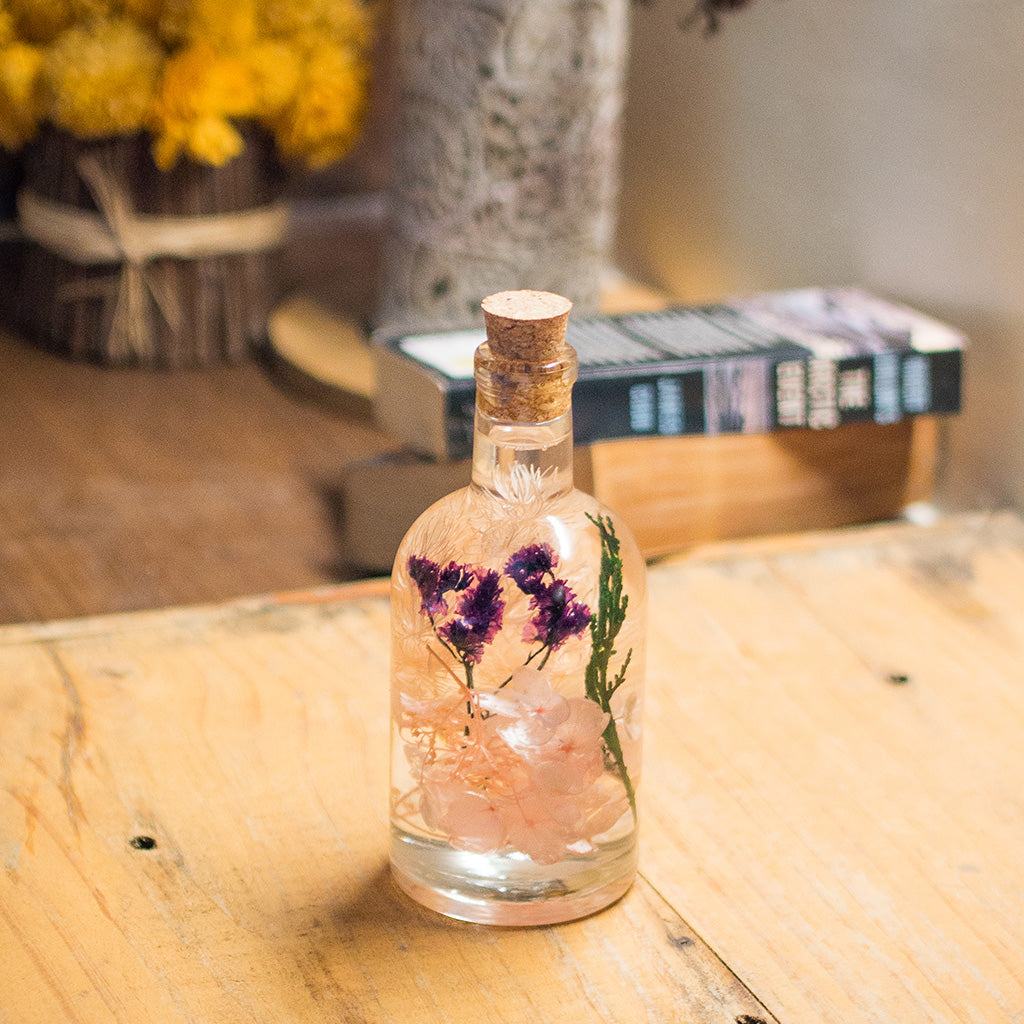 Peachy Peep Preserved Flower Tabletop on table – gentle floral décor piece.