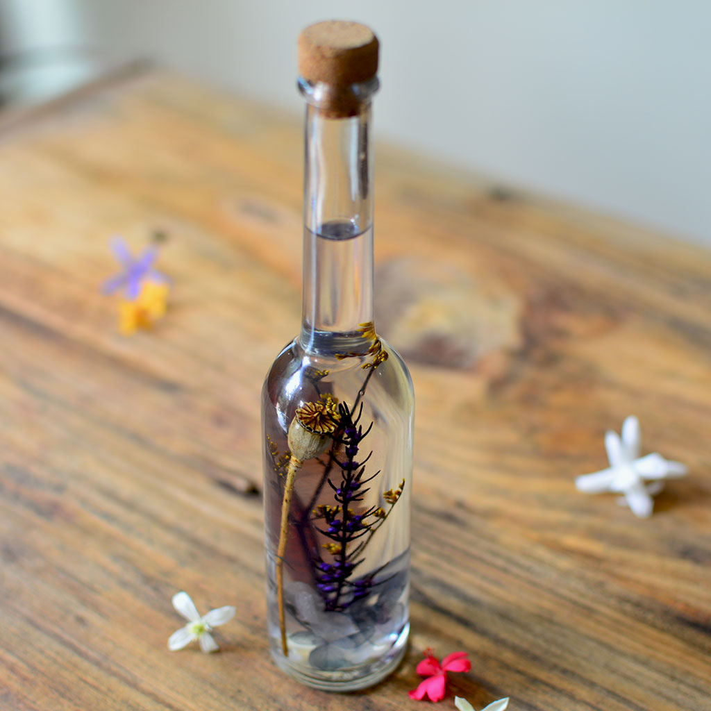 Sunkissed Souvenir Preserved Flower Tabletop placed on table – warm, inviting décor accent.