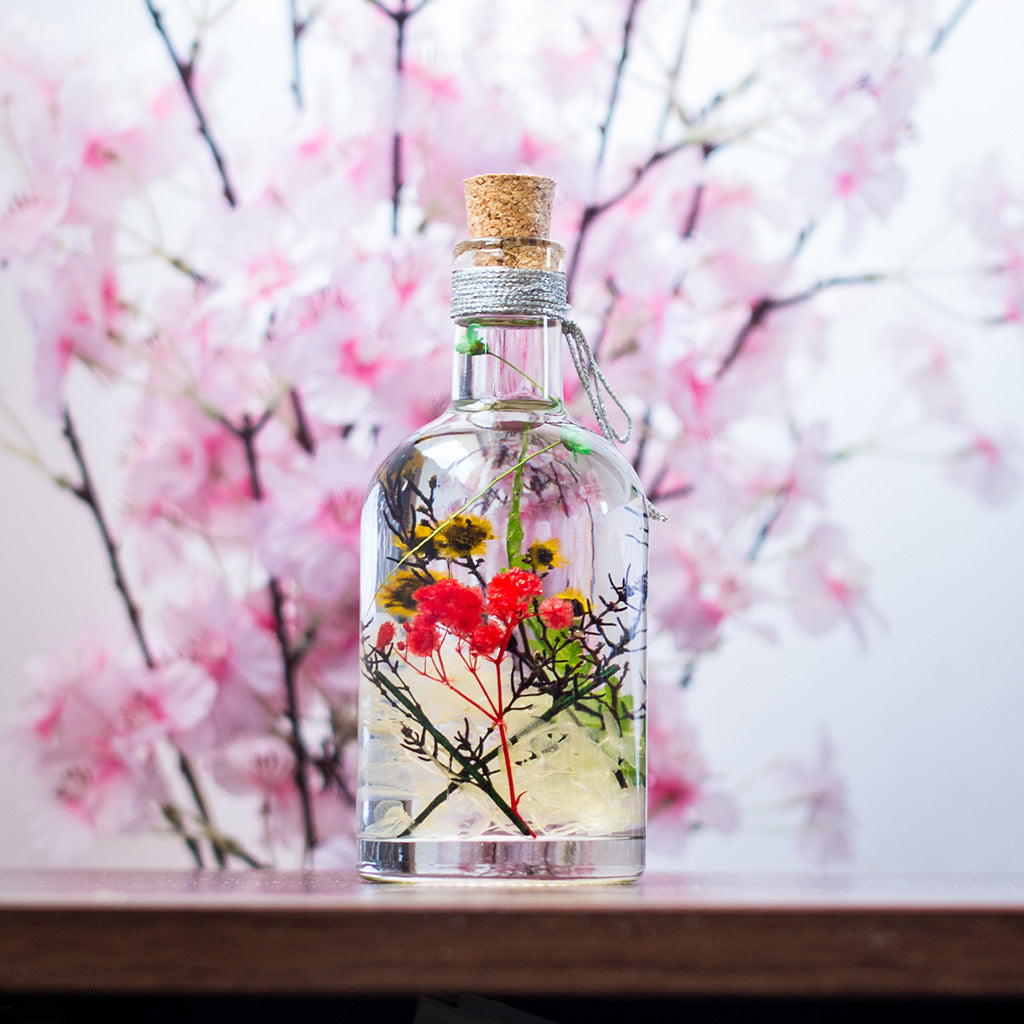 Touch of Sun Preserved Flower Tabletop placed on table – cheerful décor accent.