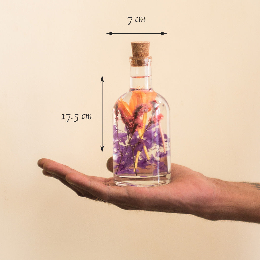 Tumultuous Tints Preserved Flower Tabletop shown in hand to display compact, lively décor size.