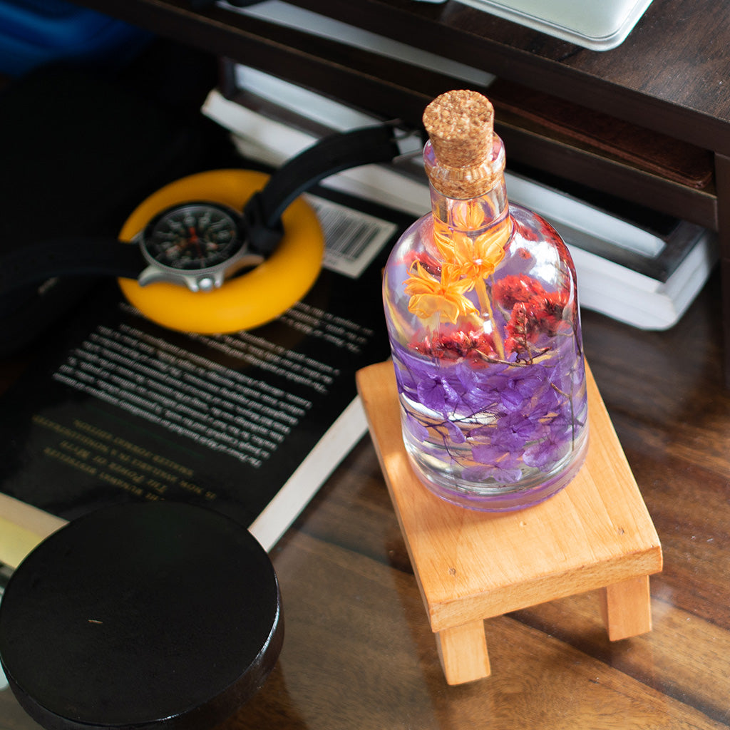 Tumultuous Tints Preserved Flower Tabletop placed on table – artistic multicolor décor accent.